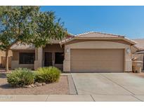 Inviting single-story home with low-maintenance landscaping and a two-car garage at 11341 W Barbara Ave, Peoria, AZ 85345