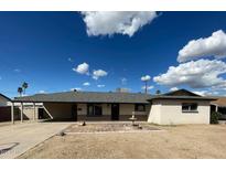 Charming single-story home with a well-manicured front yard and brick patio at 1532 W 6Th St, Tempe, AZ 85281