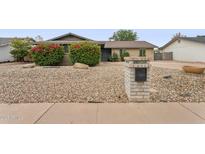 Charming single-story home with mature landscaping and a low-maintenance desert rock yard at 1649 W Royal Palm Rd, Phoenix, AZ 85021