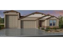 Inviting single-Gathering home displaying a neutral color palette, well-manicured lawn, and a spacious three car garage at 16784 W Whispering Wind Dr, Surprise, AZ 85387