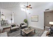 Bright living room with vaulted ceilings, ceiling fan, and neutral decor provides a welcoming atmosphere at 1847 E Kirkland Ln # C, Tempe, AZ 85281