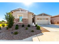 Charming single story home with stone accents and landscaped front yard, perfect for curb appeal at 32582 N Durango Ln, San Tan Valley, AZ 85143