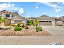 Charming home featuring desert landscaping, dual garage and neutral colors at 4396 E Austin Ln, San Tan Valley, AZ 85140