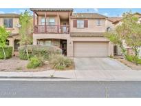 Charming two-story home with balcony, manicured landscaping, and a two-car garage at 4408 W Heyerdahl Dr, New River, AZ 85087