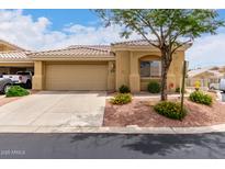 Charming single-story home with a two-car garage and well-maintained landscaping in a sunny setting at 5830 E Mckellips Rd # 101, Mesa, AZ 85215