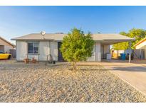 Charming single-story home with low maintenance desert landscaping and covered parking at 6960 W Berkeley Rd, Phoenix, AZ 85035
