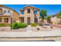 Charming two-story home with well-maintained landscaping, stone yard, and a welcoming walkway at 9148 W Meadow Dr, Peoria, AZ 85382
