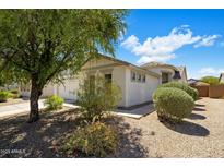 Charming home featuring beautiful landscaping, a two-car garage, and a well-maintained exterior at 2615 W Silver Streak Way, San Tan Valley, AZ 85144