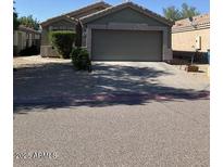 Charming single-story home with a two-car garage and well-maintained landscaping at 9726 E Butte St, Mesa, AZ 85207