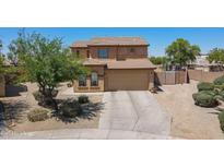 Charming two-story home with a spacious driveway and well-maintained desert landscaping at 21188 N Duncan Dr, Maricopa, AZ 85138