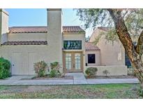 Charming home featuring a private entrance, warm stucco facade, and well-maintained landscaping at 602 N May -- # 17, Mesa, AZ 85201