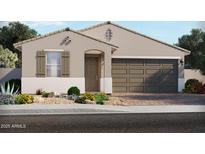 Charming single-story home with neutral stucco, a two-car garage, and desert landscaping in the front yard at 125 N 175Th Ln, Goodyear, AZ 85338