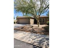 Charming single-Gathering home featuring a spacious driveway and desert landscaping for low maintenance appeal at 1333 E Cecil Ct, Casa Grande, AZ 85122
