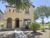 Charming two-story home featuring an inviting entryway and upper level balcony, perfect for enjoying neighborhood views at 1492 S Pike Ln, Gilbert, AZ 85296