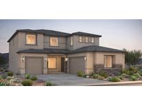 Beautiful two-story home with three-car garage and stone accents at 16711 W Questa Dr, Surprise, AZ 85387