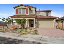 Beautiful two-story home featuring a red tile roof, desert landscaping, and a two-car garage at 19426 W San Juan Ave, Litchfield Park, AZ 85340
