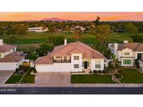 Charming two-story home with a well-manicured lawn and professional landscaping with beautiful sunset scenery at 3665 S Jojoba Way, Chandler, AZ 85248