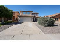 Charming two-story home with a well-maintained front yard and a spacious two-car garage at 4306 E Raven Rd, Phoenix, AZ 85044