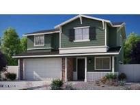 Charming two-story home featuring a two-car garage, a welcoming front porch, and a beautifully landscaped yard at 16875 N 12Th St # 13, Phoenix, AZ 85020