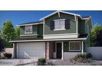 Charming two-story home featuring an attached two-car garage and neutral landscaping in front at 16875 N 12Th St # 13, Phoenix, AZ 85022
