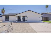 Charming single-story home with a two-car garage and low-maintenance desert landscaping at 4509 E La Puente Ave, Phoenix, AZ 85044