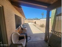 Relaxing back patio with view of pool and desert landscape at 7311 S Mcallister Ave, Tempe, AZ 85283