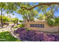 Well-manicured community signage surrounded by beautiful foliage, creating an inviting entrance at 7575 E Indian Bend Rd # 1137, Scottsdale, AZ 85250