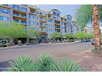 Well maintained tan building with multiple balconies and mature landscaping at 16 W Encanto Blvd # 305, Phoenix, AZ 85003