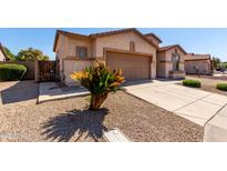Charming home featuring low-maintenance desert landscaping, rock ground cover, and a two-car garage at 2732 E Tyson St, Chandler, AZ 85225