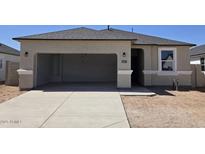 Charming single-story home featuring a two-car garage, a well-maintained stucco exterior, and a neatly paved driveway at 5457 E Mearn Rd, San Tan Valley, AZ 85140
