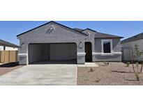 Charming single-story home with a spacious two-car garage and low-maintenance front yard at 5575 E Mearn Rd, San Tan Valley, AZ 85140