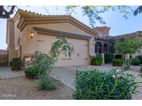 Inviting home exterior features a two-car garage and manicured landscaping for great curb appeal at 6202 E Mckellips Rd # 25, Mesa, AZ 85215