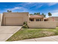 Charming home with stucco exterior, tile roof, and two-car garage, blending style and practicality at 7921 E Bonita Dr, Scottsdale, AZ 85250