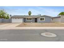 Charming single-story home with a well-maintained xeriscaped front yard and a convenient two-car garage at 845 W Shannon St, Chandler, AZ 85225