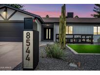 Charming home exterior with desert landscaping, modern mailbox, and welcoming entrance at 8544 E Heatherbrae Dr, Scottsdale, AZ 85251
