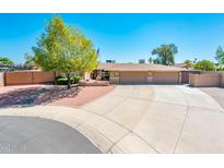 Charming home featuring a well-manicured lawn, a spacious driveway, and a welcoming two-car garage at 16425 N 46Th Dr, Glendale, AZ 85306