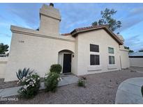 Charming single-story home with stucco exterior, desert landscaping, and red tile roof at 2019 W Lemon Tree Pl # 1124, Chandler, AZ 85224