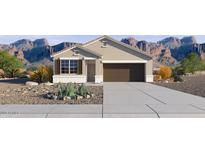 Charming single-story home with desert landscaping and a two-car garage, set against a scenic mountain backdrop at 22530 N Lynn St, Maricopa, AZ 85138