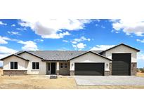 Beautiful single-story home featuring a neutral palette, gray roof, two-car garage, and brick accents at 24183 N 196Th Ln, Surprise, AZ 85387