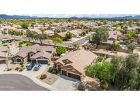 Beautiful aerial shot of the community showcasing lush landscaping and well-maintained homes at 26633 N 41St Way, Cave Creek, AZ 85331