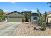Charming single-story home featuring desert landscaping and a spacious two-car garage at 30031 N Little Leaf Dr, San Tan Valley, AZ 85143