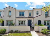 Charming townhome showcasing a stucco facade, gated entry, and well-maintained landscaping at 4077 S Sabrina Dr # 30, Chandler, AZ 85248