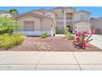 Charming two-story home with a landscaped yard and a neutral color palette at 6027 N 132Nd Dr, Litchfield Park, AZ 85340