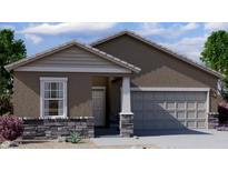 Charming single-story home with a neutral palette, stone accents, and an attached two-car garage at 6057 E Artemis Dr, Florence, AZ 85132