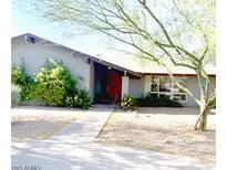 Charming single-story home with a well-maintained landscaped front yard and welcoming entrance at 6408 E Gary Rd, Scottsdale, AZ 85254