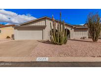 Charming single-story home with desert landscaping and attached two-car garage at 8248 E Emelita Ave, Mesa, AZ 85208