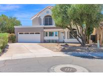 Inviting two-story home featuring a well-manicured front yard and a spacious two-car garage at 1130 S Surfside Dr, Gilbert, AZ 85233