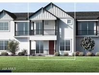 Charming townhome with a white facade, inviting balconies, and well-manicured green lawn at 11300 N Casa Dega Dr # 1090, Surprise, AZ 85388