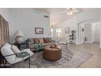 Cozy living room with stylish decor, featuring comfortable seating and an inviting atmosphere at 11520 W Lizard Ct, Surprise, AZ 85378
