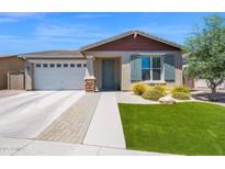 Beautiful single-story home with well-maintained lawn, desert landscaping, and a two car garage at 22262 E Cherrywood Ct, Queen Creek, AZ 85142